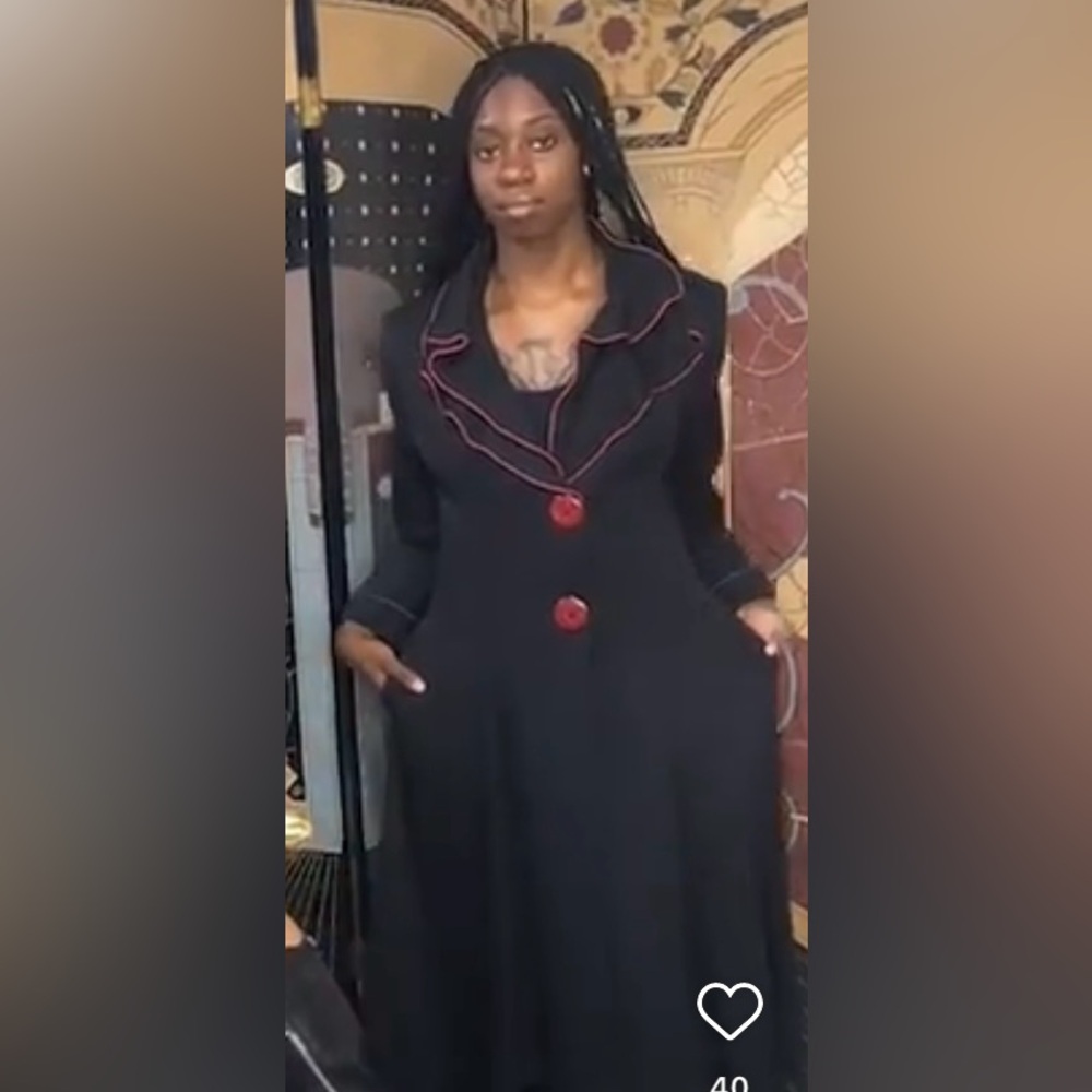 Black And Red Coat With A Tailing Effect - image 1